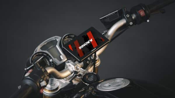 Smartphone mounted on a motorcycle handlebar displaying a graphic with the text "INNOVV" on its screen, set against a dark background.